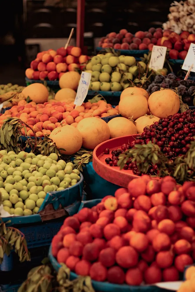 A market stall piled with fresh fruit