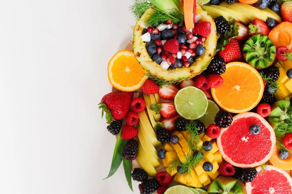 A flat lay of assorted tropical fruits